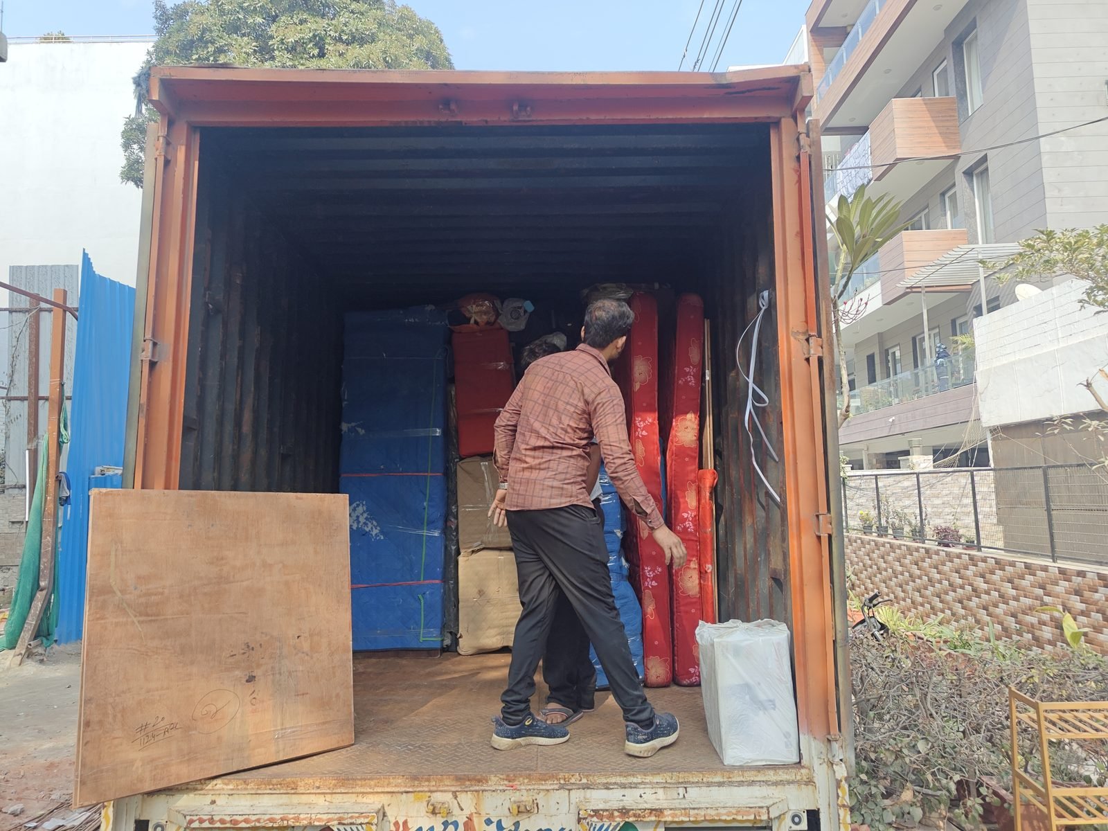 Crew loading packed household goods into a Defence Relocation Services truck